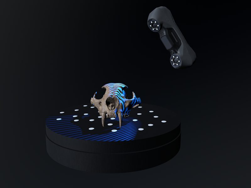 Blue-laser scanner scanning an object on a turntable