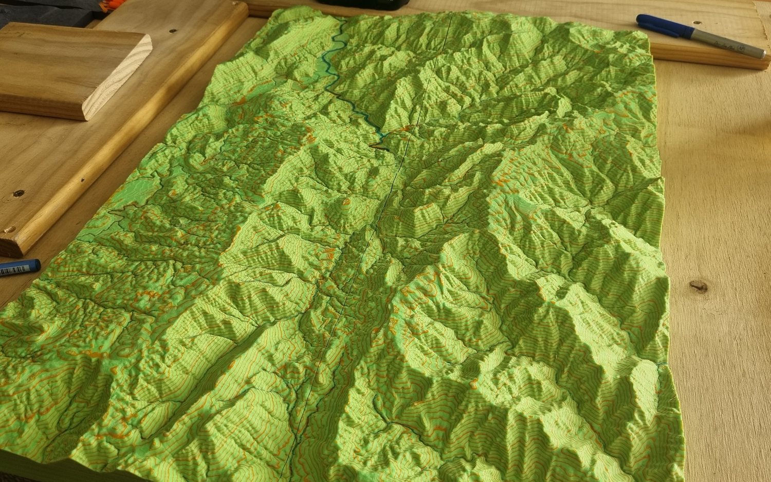 A terrain print on the workbench part way through finishing